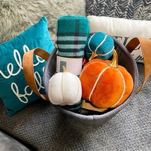 Coming soon. Pumpkins, pillows, blanket, Gray basket.
